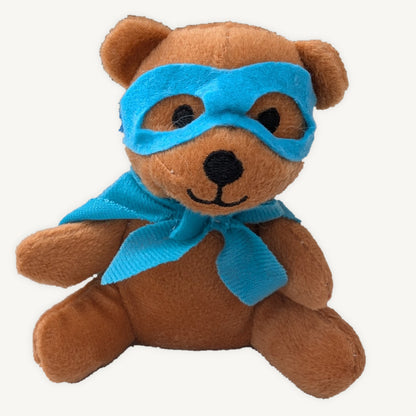 Brown plush superhero teddy wearing a blue mask and cape, shown from the front