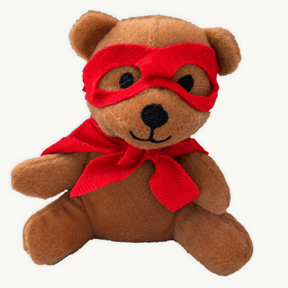 Brown plush teddy wearing a red superhero mask and cape, shown from the front